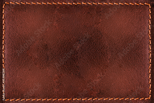 Red leather background with seams