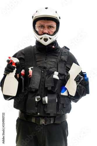 Concept Isolated portrait on white background man in a black military uniform in a white helmet with cleaning products in his hands