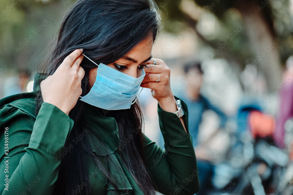 Portrait of an Indian female wearing medical mask to prevent herself from the Corona Virus Pandemic Portrait of an Indian female wearing medical mask to prevent herself from the Corona Virus Pandemic