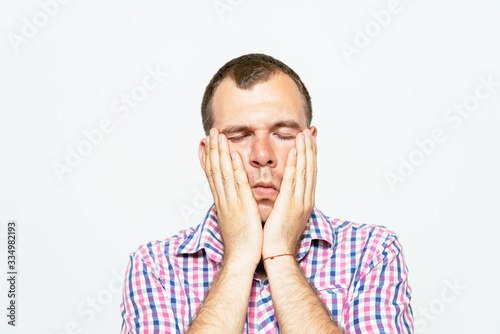 Young businessman holding head in his hands