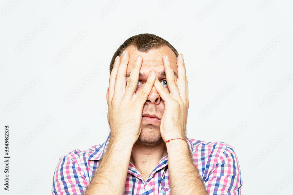 Young businessman holding head in his hands Young businessman holding head in his hands