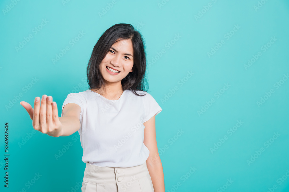 woman smile wear white t-shirt making gesture with hand inviting to come woman smile wear white t-shirt making gesture with hand inviting to come