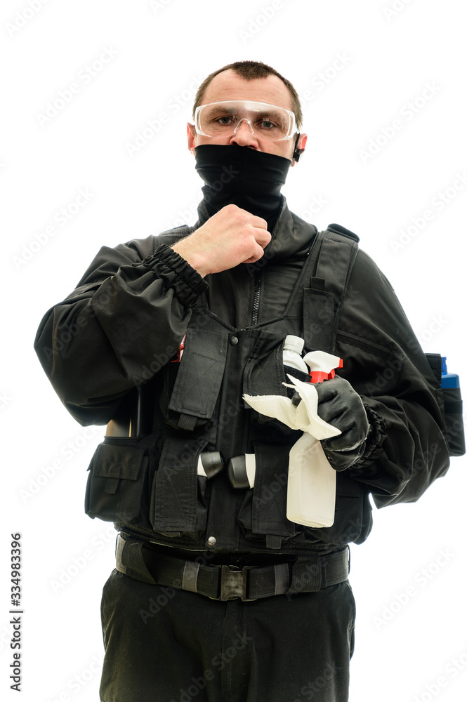 Concept concept Isolated portrait on a white background man in black military uniform with cleaning products in his hands Concept concept Isolated portrait on a white background man in black military uniform with cleaning products in his hands