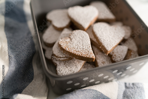 freshly baked heart-shaped cookies prepared on Mother's Day. Sugar, Cinnamon, and lots of love