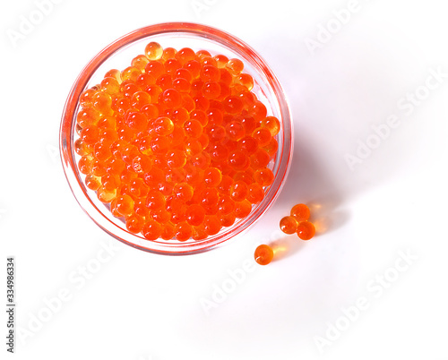 Caviar in glass bowl on white background top view. Isolated