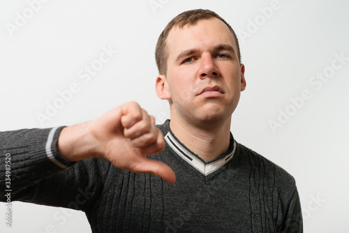 man showing a thumb down gesture
