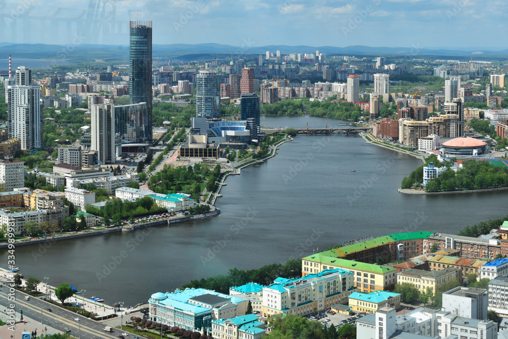 Yekaterinburg, the capital of the Urals, aerial view. Many beautiful residential and commercial buildings, as well as the architectural ensemble of the city, under the summer sun, top view.