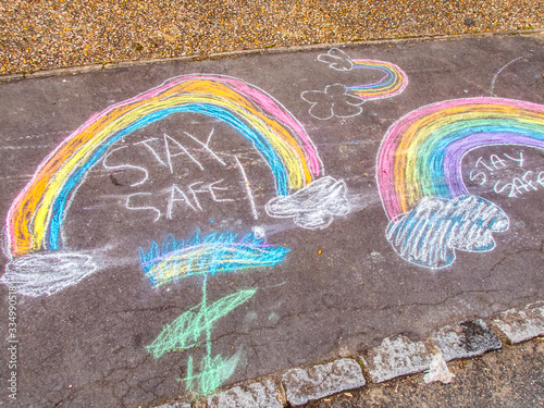 Stay Safe Chalk Drawing Words and Rainbow on Pavement