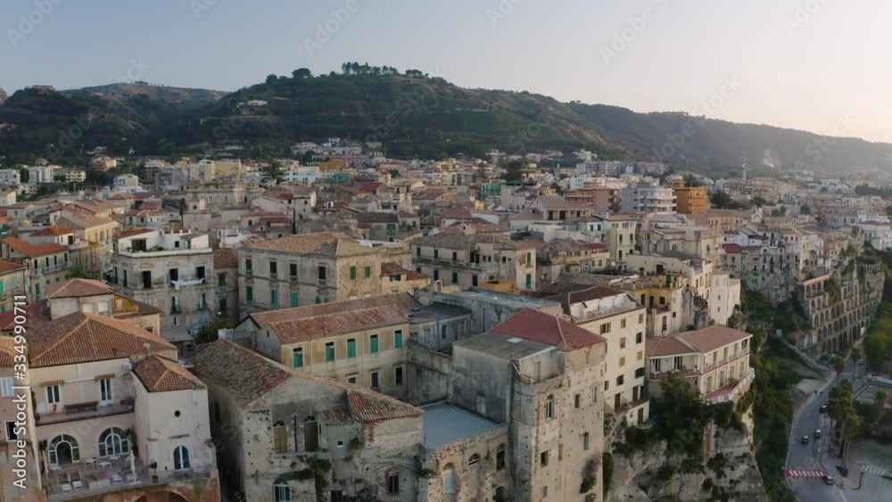 AERIAL: Close Up of Colorful Houses on Edge of Cliffs at Sunset, Tropea Italy AERIAL: Close Up of Colorful Houses on Edge of Cliffs at Sunset, Tropea Italy