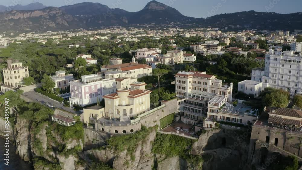 AERIAL: Buildings on Edge of Cliffs in Sorrento Italy Revealed, Sunset AERIAL: Buildings on Edge of Cliffs in Sorrento Italy Revealed, Sunset