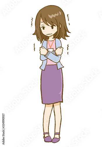 体調不良で寒気を感じる女性　/カーディガン、スカート