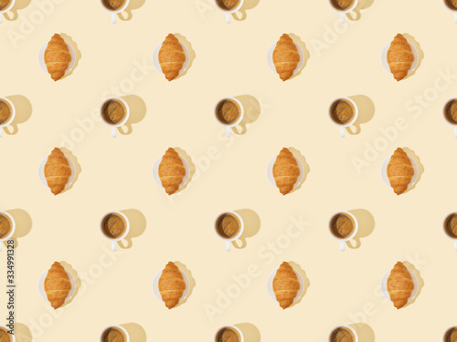 top view of croissants and coffee on beige, seamless background pattern