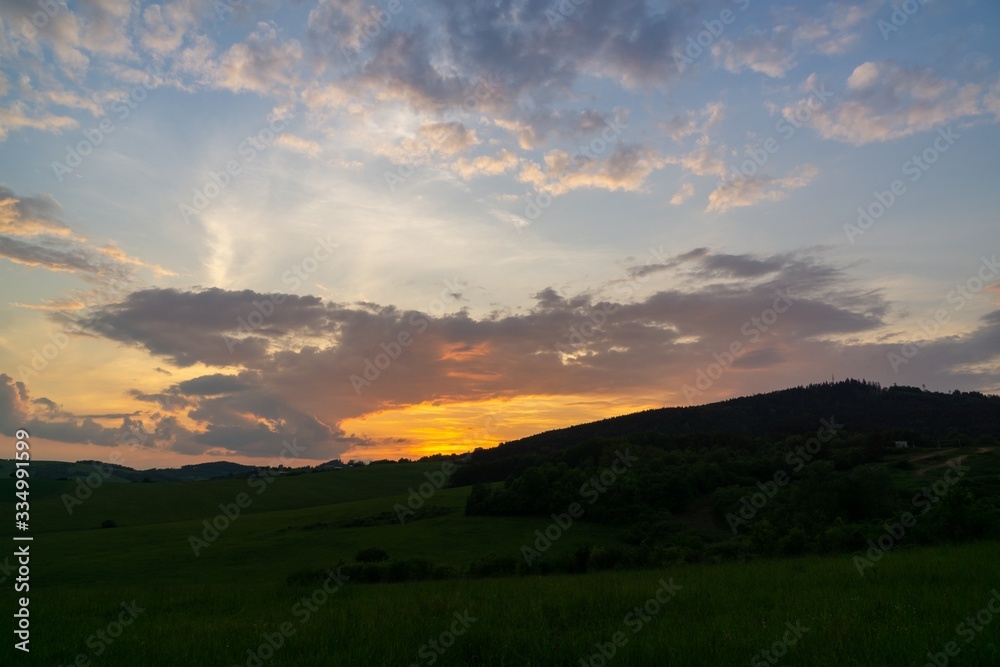 Sunrise or sunset over the hills and meadow. Slovakia