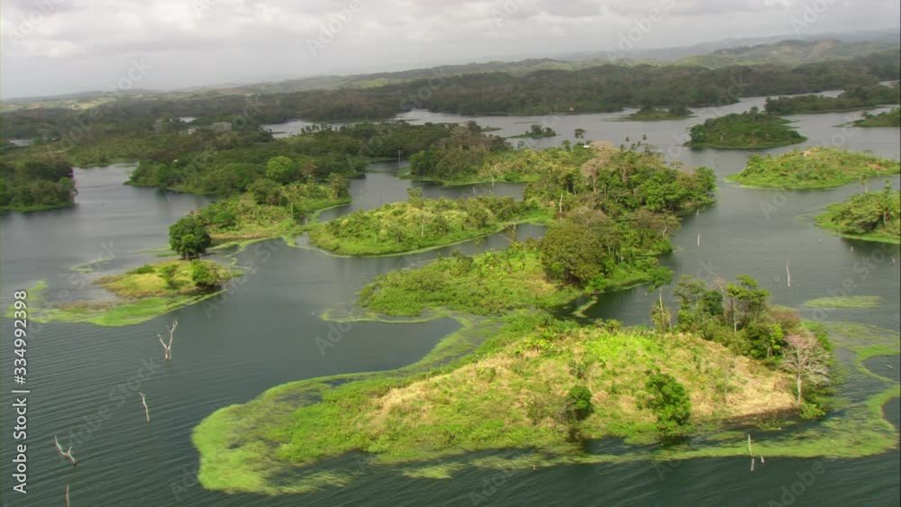 Aerial view of Lake Bayano, small islands with palms and cloud forest in Panama Central America, filmed with Cineflex stabilization camera system