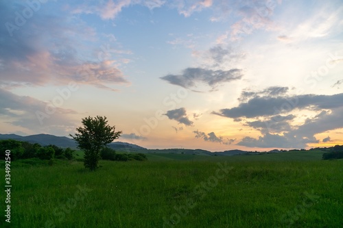 Sunrise or sunset over the hills and meadow. Slovakia