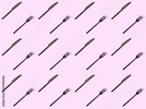 top view of black knives and forks, seamless background pattern