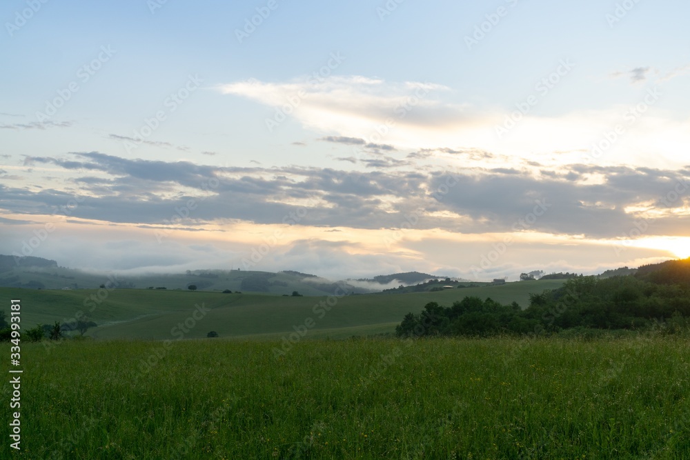 Sunrise or sunset over the hills and meadow. Slovakia