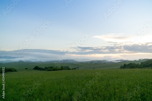 Sunrise or sunset over the hills and meadow. Slovakia