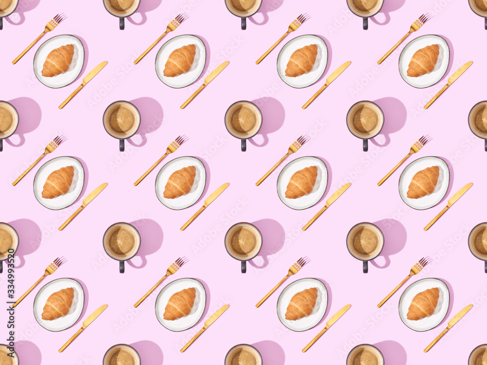 top view of cutlery, croissants on plates and coffee on pink, seamless background pattern top view of cutlery, croissants on plates and coffee on pink, seamless background pattern