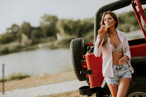 Young woman relaxing by the...