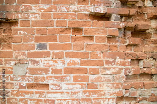 old brickwork, red brick wall with jagged individual bricks