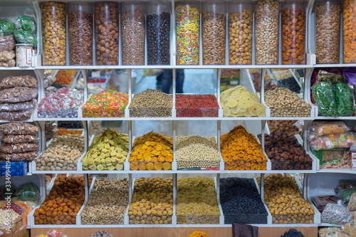 Market stall with various dried fruits and nuts