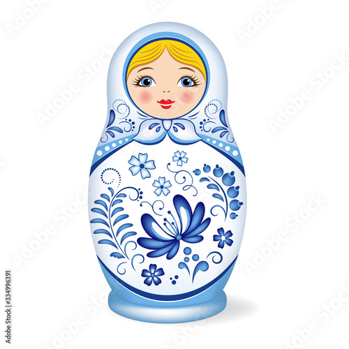 Russian wooden nesting doll. Babushka or Matryoshka. Decorated with Gzhel, Russian traditional painted floral pattern. Folk arts and crafts.