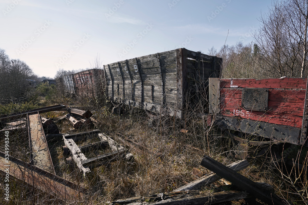 Abandoned train depot with various trains and carriages in different states of decay. Abandoned train depot with various trains and carriages in different states of decay.