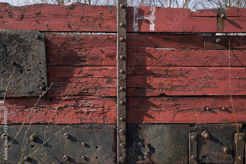 Abandoned train depot with various trains and carriages in different states of decay.