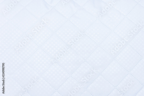 White hipoallergenic textile background for pillow or blanket. Allergy dust concept. Copy space.