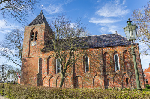 Historic church of old village Krewerd in Groningen, Netherlands photo