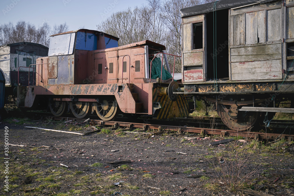 Abandoned train depot with various trains and carriages in different states of decay. Abandoned train depot with various trains and carriages in different states of decay.