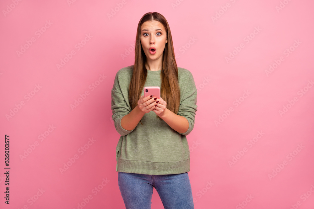 Portrait of astonished girl use smartphone impressed by unbelievable social media novelty scream wow omg wear good look jumper isolated over pastel color background Portrait of astonished girl use smartphone impressed by unbelievable social media novelty scream wow omg wear good look jumper isolated over pastel color background
