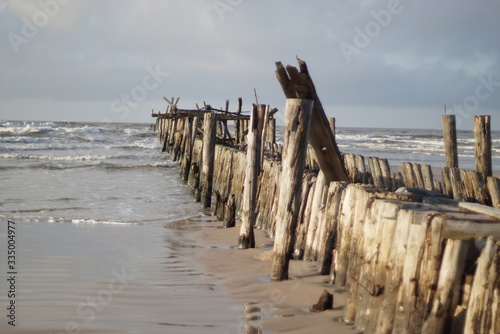 Old wooden pier on the beach