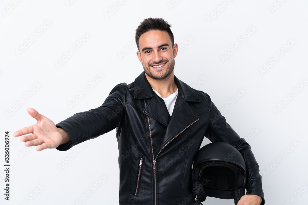 Man with a motorcycle helmet presenting and inviting to come with hand Man with a motorcycle helmet presenting and inviting to come with hand