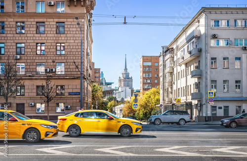                            yellow taxi on the highway  in Moscow. Caption  Smolenskaya Square 13 21