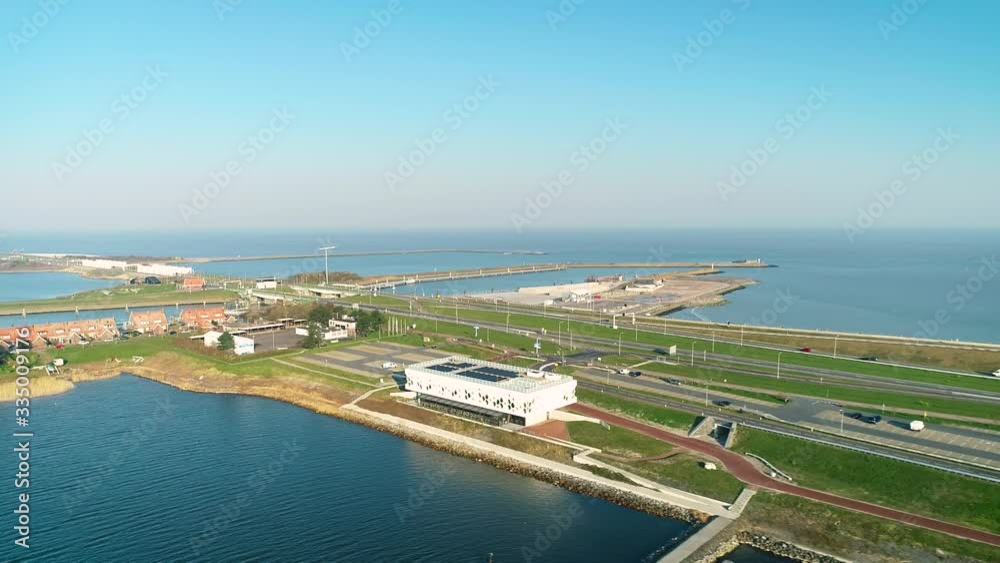 Enclosure Dam (Afsluitdijk): Kornwerderzand with Buildings and a Parking Lot, Zooming Out - Friesland, Netherlands / Holland – 4K Drone Footage Enclosure Dam (Afsluitdijk): Kornwerderzand with Buildings and a Parking Lot, Zooming Out - Friesland, Netherlands / Holland – 4K Drone Footage