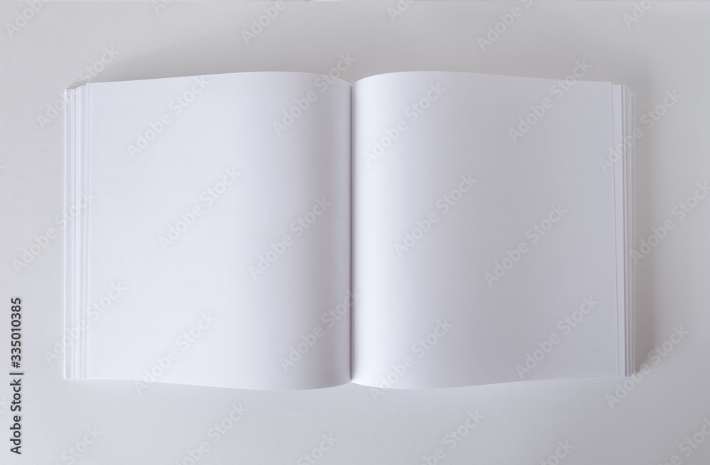 Mockup of an empty open book in square format. Template for design.