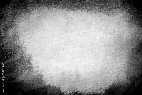 An abstract faded black and white grunge background image.