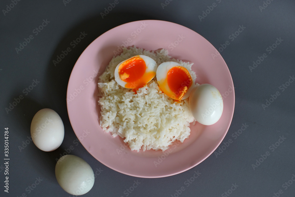 Boiled duck egg and Jasmine rice on a plate, Cheap Thai food Boiled duck egg and Jasmine rice on a plate, Cheap Thai food
