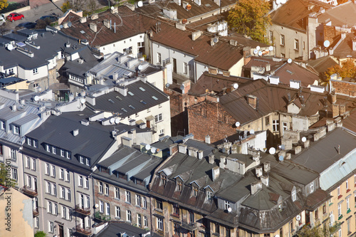 Aerial. Roofs of the houses in the city. Old district in a European city.  Top view of the town sleeping area. photo