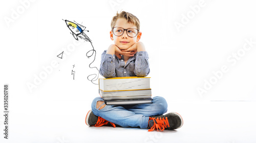 Preschooler with books ready for school - big dream for the future