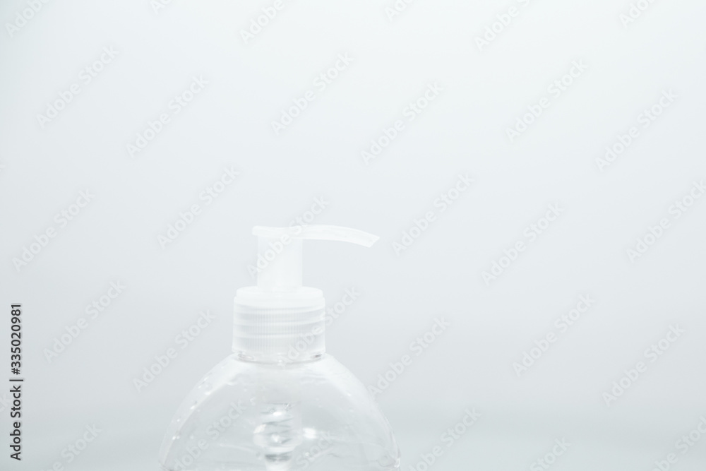 Antibacterial transparent hand sanitizer gel in a plastic bottle. Coronavirus (Covid-19) preventive measures top view concept