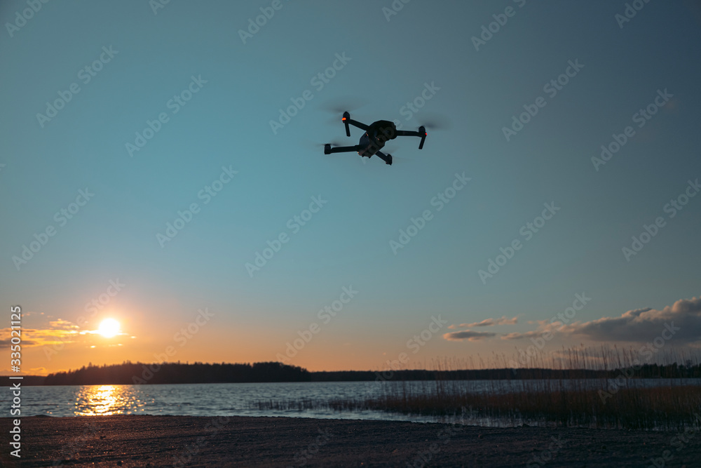 Drone on a sunset background. There is a place for text