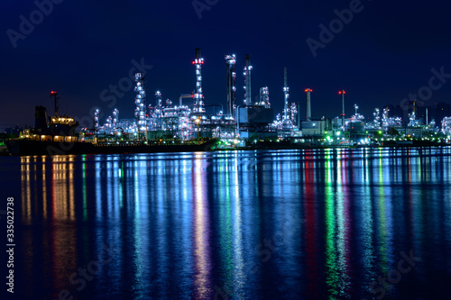 oil refinery industry plant in twilight morning with a reflection in the river. Bangkok Thailand.