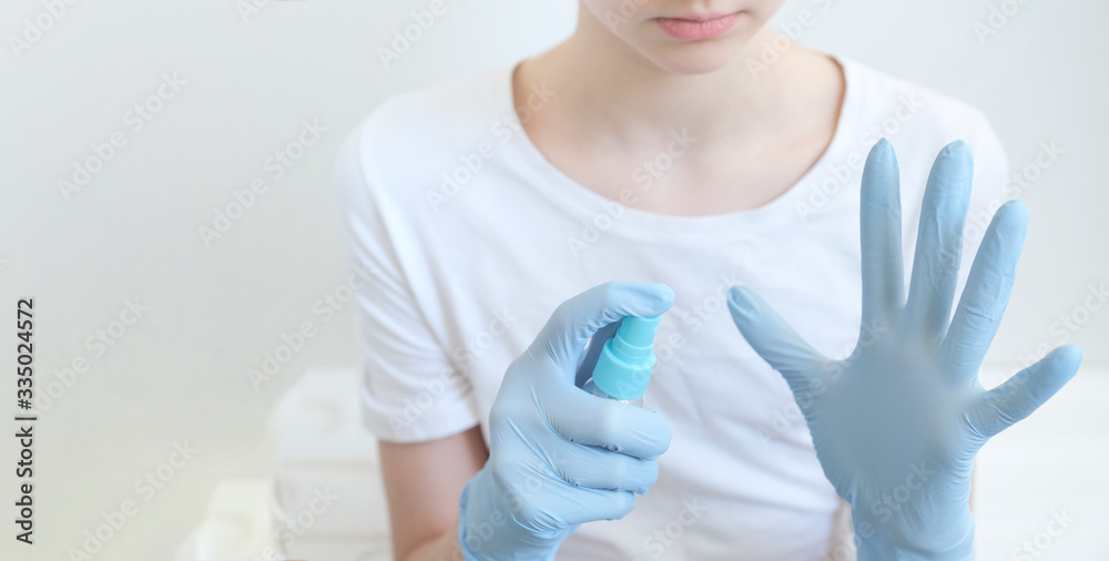 Hand treatment with antiseptic. Bottle with antiseptic for hands on a white background. Hygiene and disinfection. Virus and methods of protection. Copy space Hand treatment with antiseptic. Bottle with antiseptic for hands on a white background. Hygiene and disinfection. Virus and methods of protection. Copy space