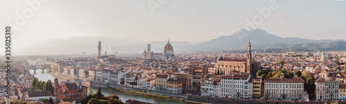 Piazzale Michelangelo view Florence Italy. Beautiful panoramic shot of the city Florence, Tuscany, Italy. Buildings,cathedrals, and mountains on the sunset. High resolution. 