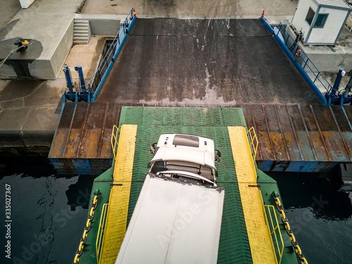 Loading of semi-trailer trucks in the ferry photo