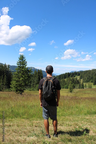 Man walking in the mountains with backpack