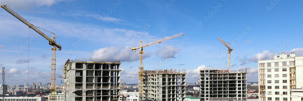 City panorama, construction site with cranes